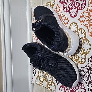 Michael Kors wedge, lace-up sneakers.